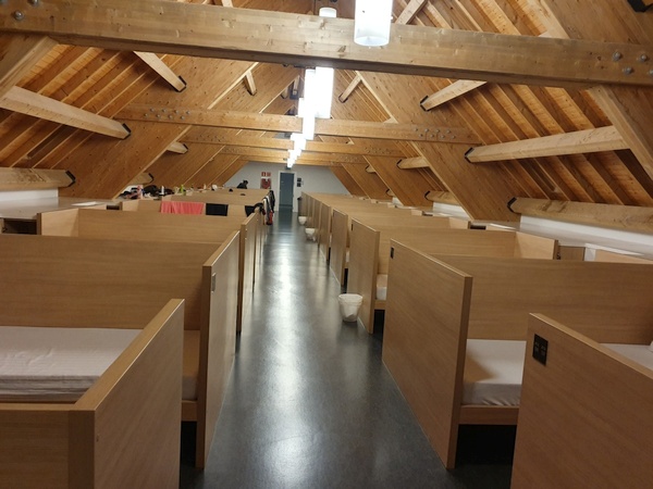 A dormitory at Roncevalles. 100 beds in each but lots of privacy. No gender separation. Excellent quality, excellent bathrooms. I think they have a total of more than 500 beds. Run by voluntaries. No complaints about my snoring....