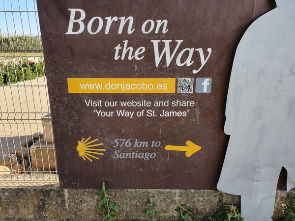 The sign of a winery next to Hospital de San Juan de Acre at Navarette.