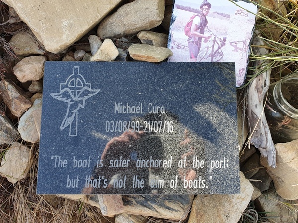 A remembrance sign for another pilgrim whose life ended here. A young one. And a slogan worth remembering.