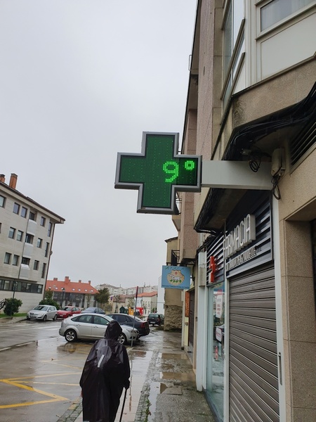 Walking into Santiago in rain and only 9° C. Cold and wet. Elia in front