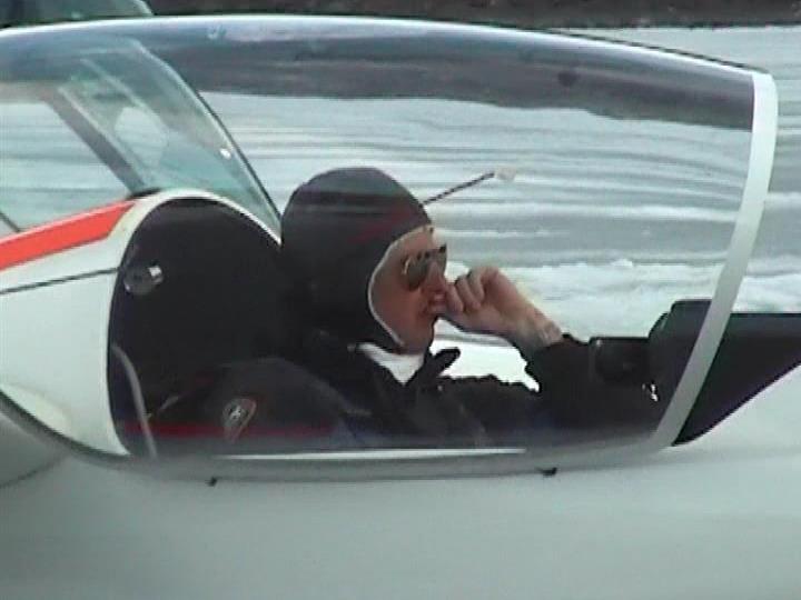 A WW1 pilot in a glider on a frozen lake