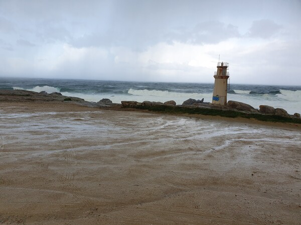 At Faro de Muxia. Soaking rain and strong waves. Glad I was in a bus on not on foot.